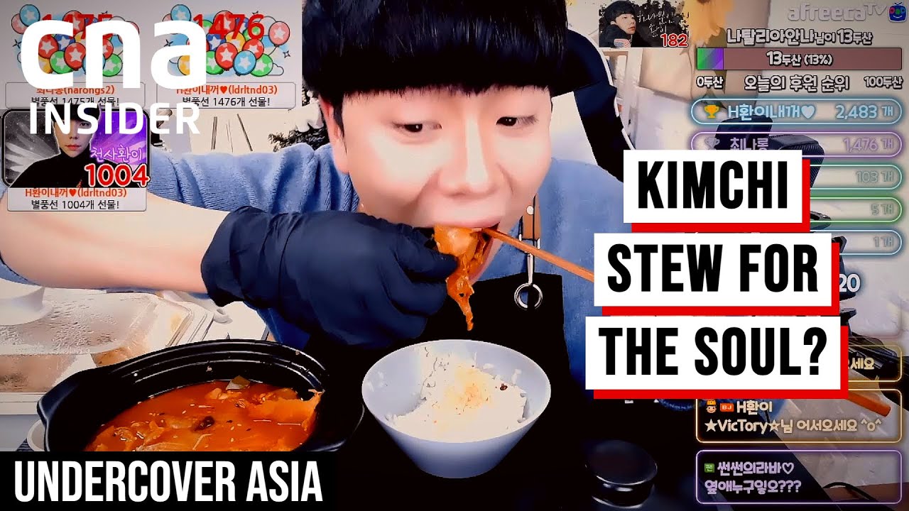A documentary still showing the rise of Korean mukbang creators with rows of food being prepared for an extreme eating livestream broadcast