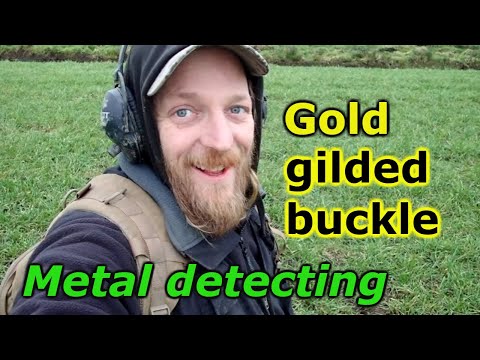 Metal detecting in a new field. Finding old Gold gilded buckle and relics