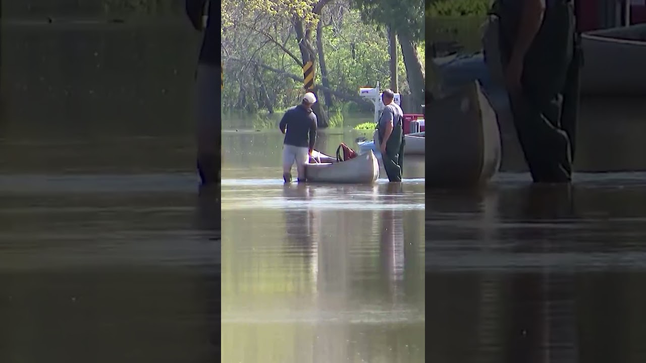 Residents travel by boat after severe weather caused Fox River flooding