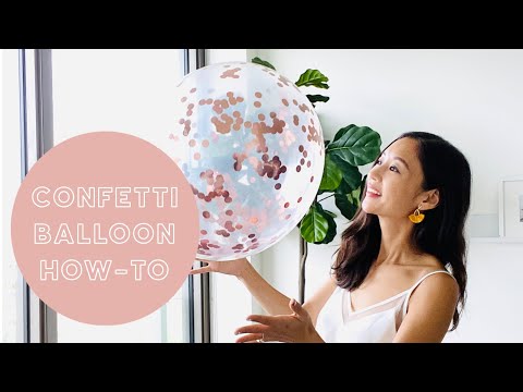 Part of a video titled HOW TO: CONFETTI BALLOONS - YouTube