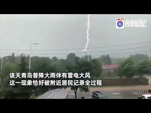 Watch lightning strike a lamppost 12 TIMES in 10 SECONDS in China's Qingdao city.