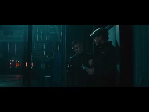 Action sequence frame from The Man from U.N.C.L.E. showing a chase with 1960s vehicles and stylised editing