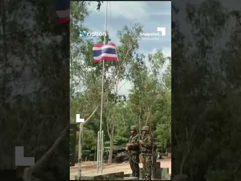 Thai soldiers sing national anthem at Ta Muen Thom Castle in Surin