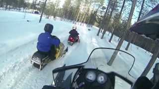preview picture of video 'Arctic Circle Snowmobile Park: Children snowmobiling Santa Claus Village Rovaniemi Lapland Finland'