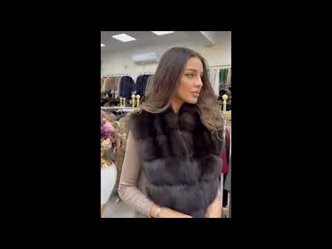 Elegant Women Trying On Luxurious Fur Coats