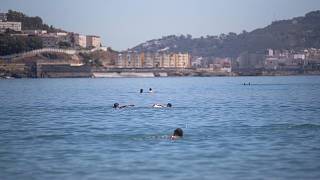 Hundreds of migrants swim across to Spanish enclave Ceuta from Morocco