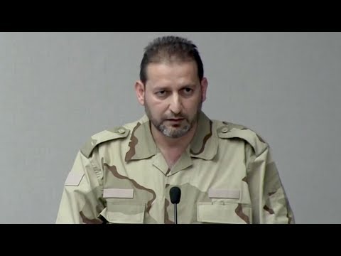 تقرير تلفزيوني حول فاتح حسون وقصة تسليمه حمص وسجل يغص بالعمالة والتنازلات