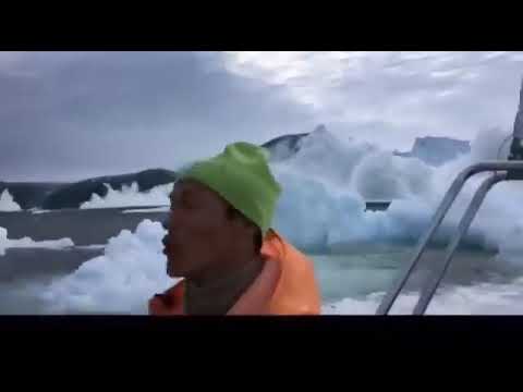 Small Boat Hauls to Escape Iceberg Tsunami