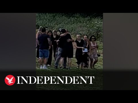 Moment man gatecrashes own funeral in helicopter after faking his death