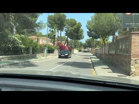 Driving up to Pinar de Campoverde Village. Costa Blanca, Spain