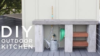 DIY Outdoor Kitchen with Concrete countertops and sink
