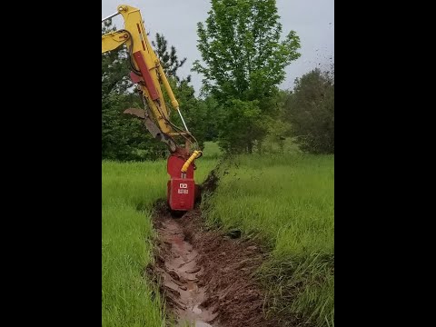 DitchDoctor ditch maintenance tool for a compact excavator to quickly drain water from ditches