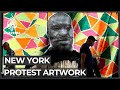 NYC artists display BLM street art on boarded-up storefronts