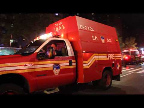 FDNY Ladder 23 And CPC 23 Staging On Scene Of A 3rd Alarm Fire In Manhattan, New York.
