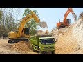 Excavator Dump Truck Digging Limestone On Road Construction Kobelco SK200 Komatsu PC200