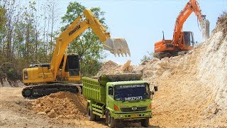 Excavator Dump Truck Digging Limestone On Road Con