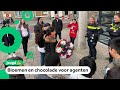 Kinderen bedanken agenten voor hun werk tijdens rellen