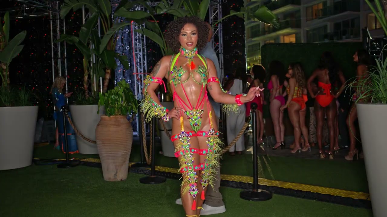 Trinidad Model Achfah Henry poses at Miami Swim Week The Shows in colorful festival themed piece