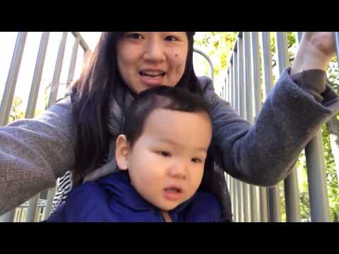Evan goes down the slide with mama
