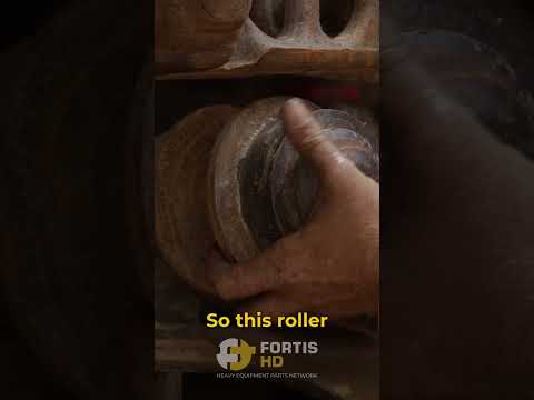 Part of a video titled Changing An Upper Roller on an #excavator - YouTube