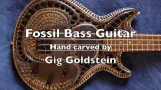 Carved bass guitar with old fossil theme