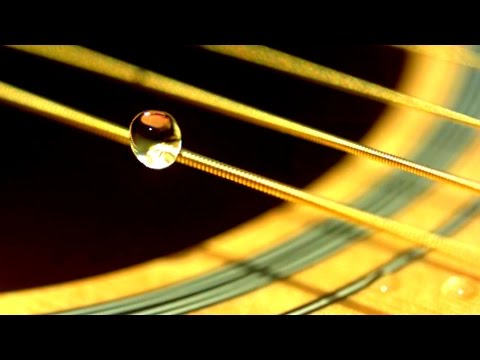 Plucking A Guitar String In Slow Motion
