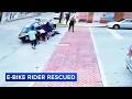 Community members lift car to rescue trapped e-bike rider in Prospect Park