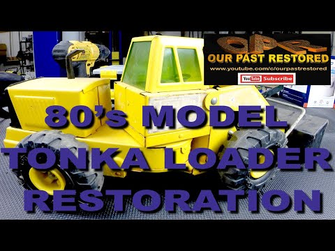 Tonka loader restoration. Sandblasting and powder coating included.