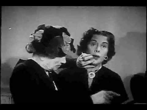 Helen Keller "Listens" to Gladys Swarthout Sing.