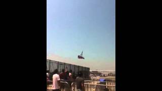 Guy rides coney island boardwalk flight