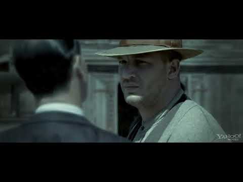 Lawless (2012) official trailer frame: the Bondurant brothers face the road at dusk