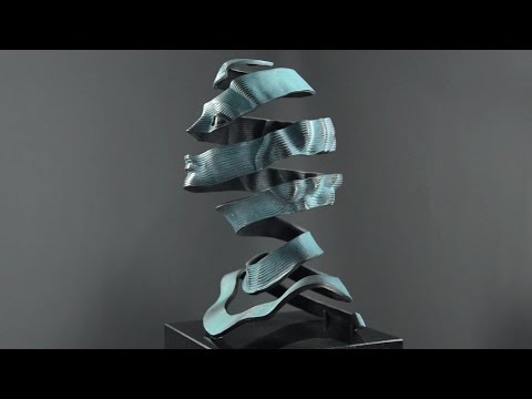 M.C. Escher "HÜLLE" Bronzeskulptur  -  Porträt einer Frau