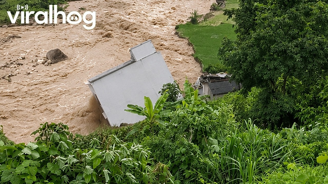 House Collapses Into Flooded River || ViralHog