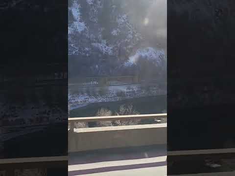 UP Local heading east with empty centerbeam flats through Glenwood Springs Canyon 12/29/25