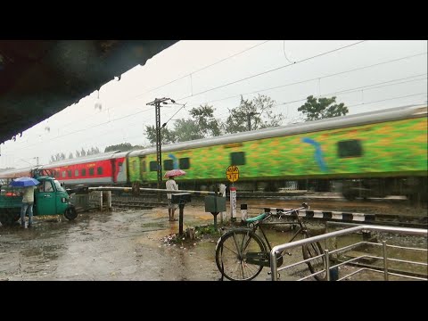 Express and Freight train in heavy rain with Violent and furious speed