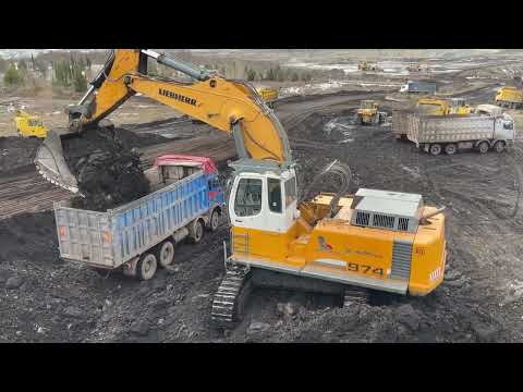 Liebherr 974 Excavator With The Help Of The Cat 160H Grader Loading Trucks - Labrianidis Mining