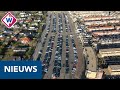 Dagjesmensen parkeren auto's in de Bollenstreek - OMROEP WEST