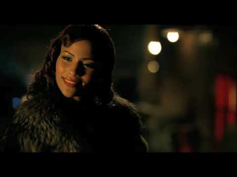 Idlewild trailer frame: Percival at the piano in the Church club as dancers whirl past deco light
