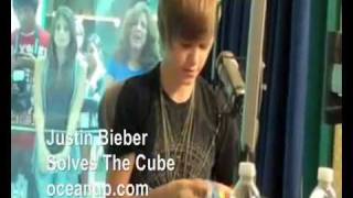 Justin Bieber solving a Rubik's Cube