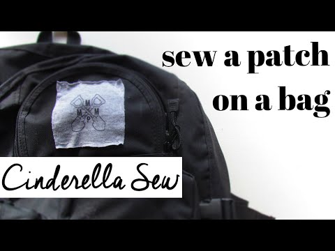 Part of a video titled How to put patches on a backpack - Easy DIY tutorial - YouTube