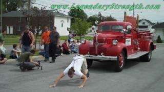 Strongman Picnic Pulling Fire Engine By Hair