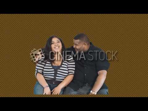 CinemaStock - Greenscreen - Black couple sitting watching a movie romantic cuddle