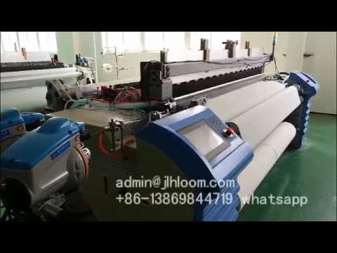 air jet loom with automatic weft feeding and filling system