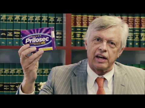 man holding box of Prilosec