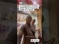 A Malaysian Woman Wearing A Crop Top Hijab In A Mall Shorts