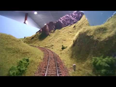 Railfanning cab ride view of a large modular model railroad built in FREMO or Mod-U-Trak standard