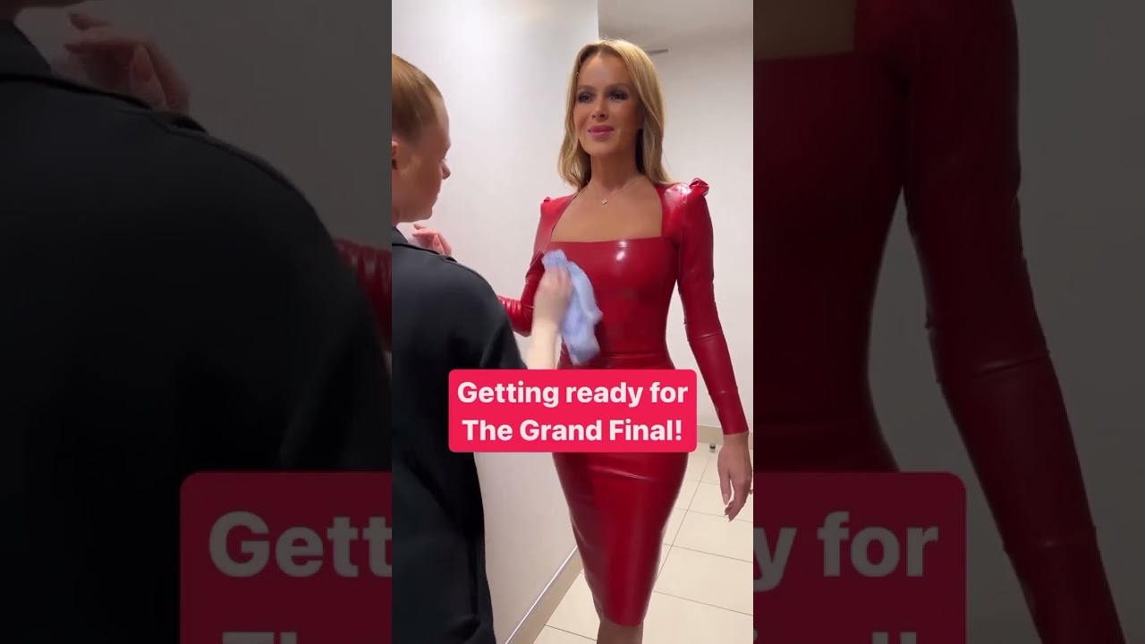 This woman has the dream job - polishing Amanda Holden's latex dress!