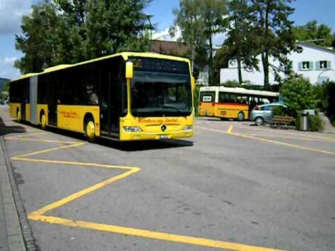 an old postbus and a new aagl-bus