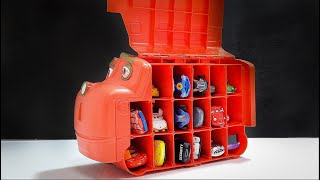 The train characters include many Cars miniature cars with human faces.