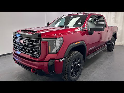 2026 GMC Sierra 3500HD 4WD Crew Cab Standard Box AT4 in Red for sale at Davis GMC Buick Lethbridge in Lethbridge, AB